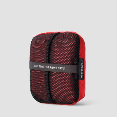 Raincover 50L-80L in the color Beaming Red.